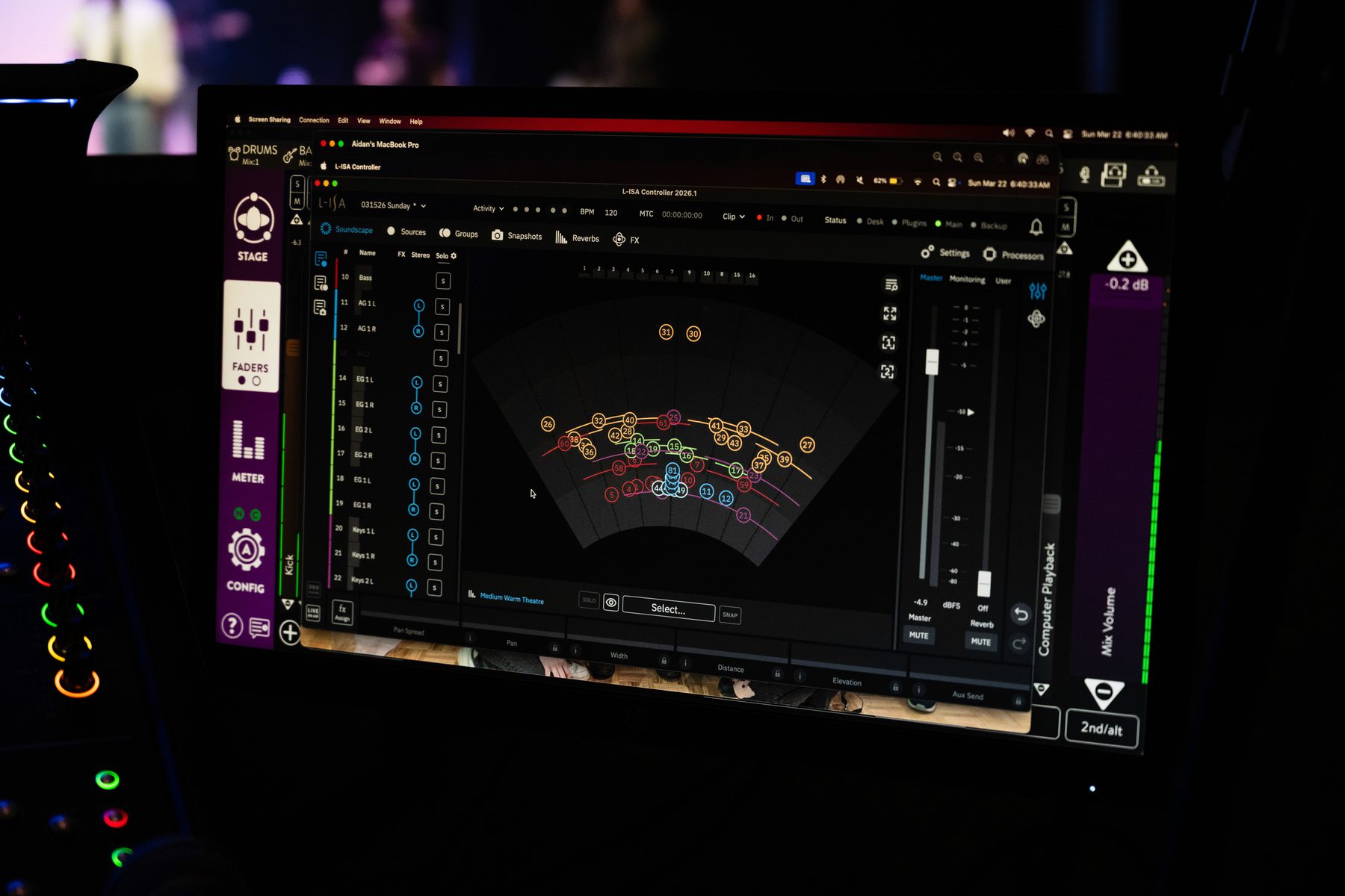 AV technician setting up a live sound system on stage